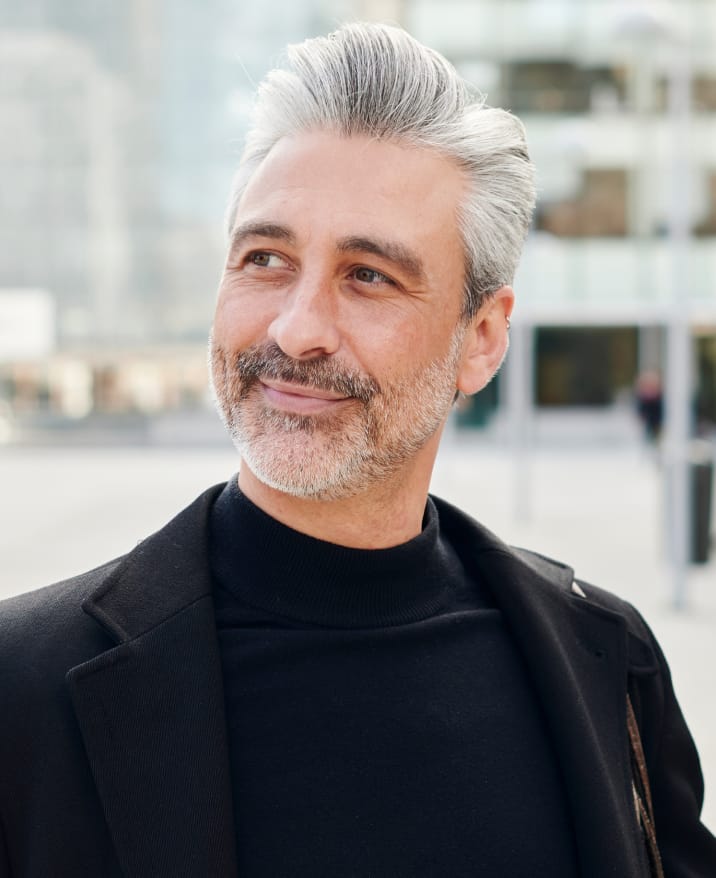 Close up of man smiling.